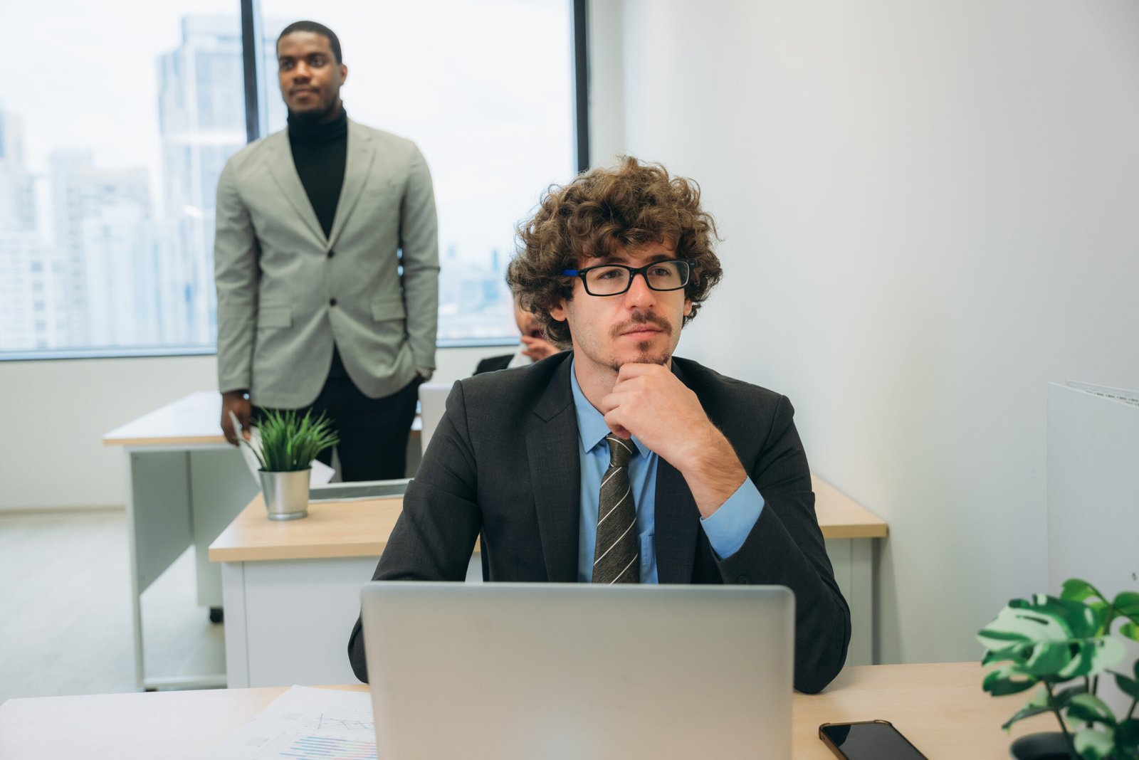 A business professional analyzing user data on a laptop, making informed decisions based on real insights.